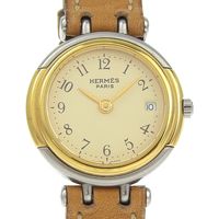 Pre-owned Hermès Windsor women's watch in stainless steel and leather with a quartz movement, analog display, and a beige dial.