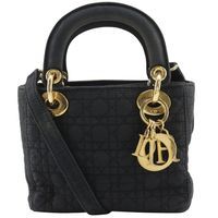 Pre-owned Christian Dior Lady Dior Mini Cannage handbag in black nylon with a 2-way flap. Suitable for crossbody or handbag use.