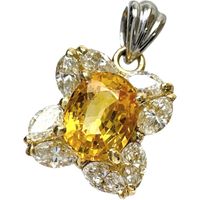 二手女士TOP，鑲嵌一顆 1.24 克拉黃色藍寶石（未擴散）和一顆 0.66 克拉鑽石，18K 金/Pt900 鉑金材質，重 2.9 克。