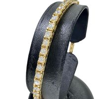 Pre-owned women's 18K gold tennis bracelet with diamonds (approximately 4 carats), weighing 16.0g and measuring 18.7cm.