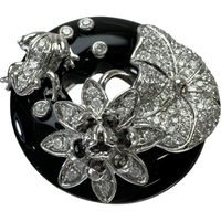 Pre-owned frog design ring, size 15, featuring 0.82ct diamonds, 20.50ct onyx, and 14.2g 18K white gold.