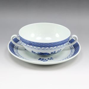 Pre-owned Royal Copenhagen Faience Trunk Weber soup cup and saucer.