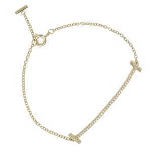 蒂芙尼 T Smile小手镯，18K 黄金镶钻，约 2.45 克，适合手腕周长最大 16 厘米，二手，女士款。