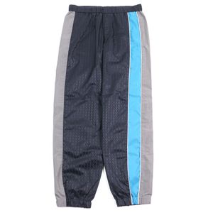 Excellent condition VALENTINO WV3RBA337GQ nylon pants with V logo print and side stripes, size 48, navy, gray, and blue. Authentic, made in Italy. Men's.