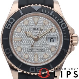 Pre-owned Rolex Yacht-Master 40 watch with a diamond-paved dial, model number 126655. Includes box and warranty card. 18K gold, platinum, and rubber. Diamond-finished. Excellent condition.